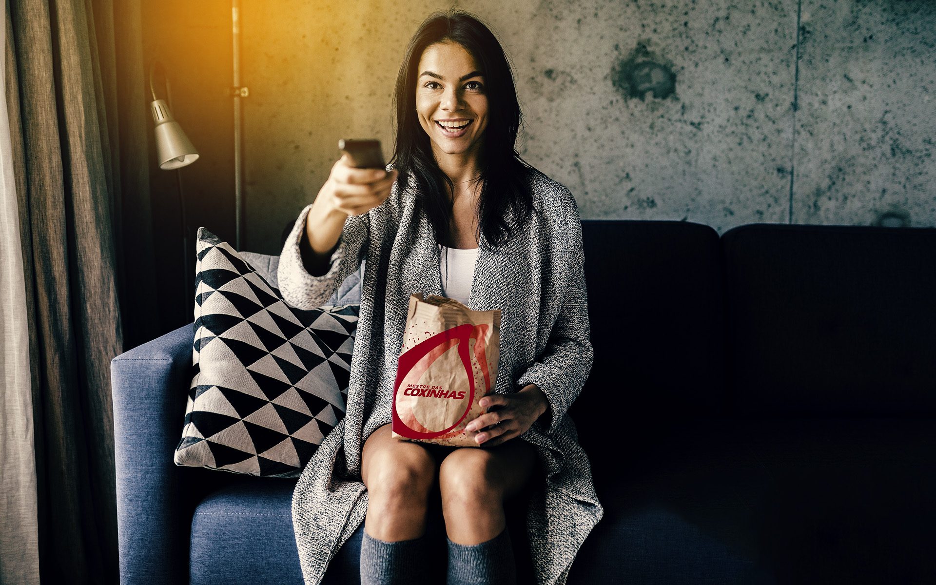 young attractive woman in casual outfit relaxing at home watching movies on tv holding remote control, switching channels, eating popcorn, leisure, having fun, smiling sitting on sofa, cheerful, happy